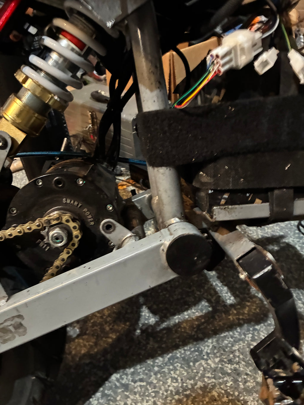 Swing arm end cap/airtag holder