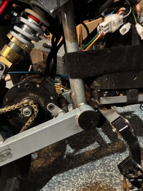 Swing arm end cap/airtag holder