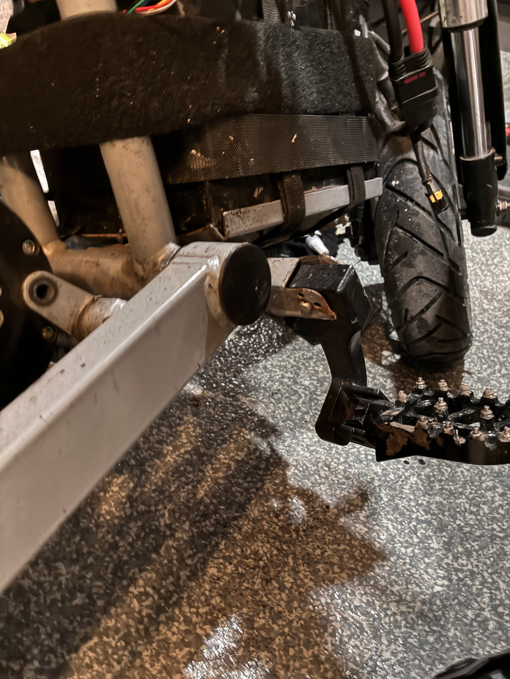 Swing arm end cap/airtag holder