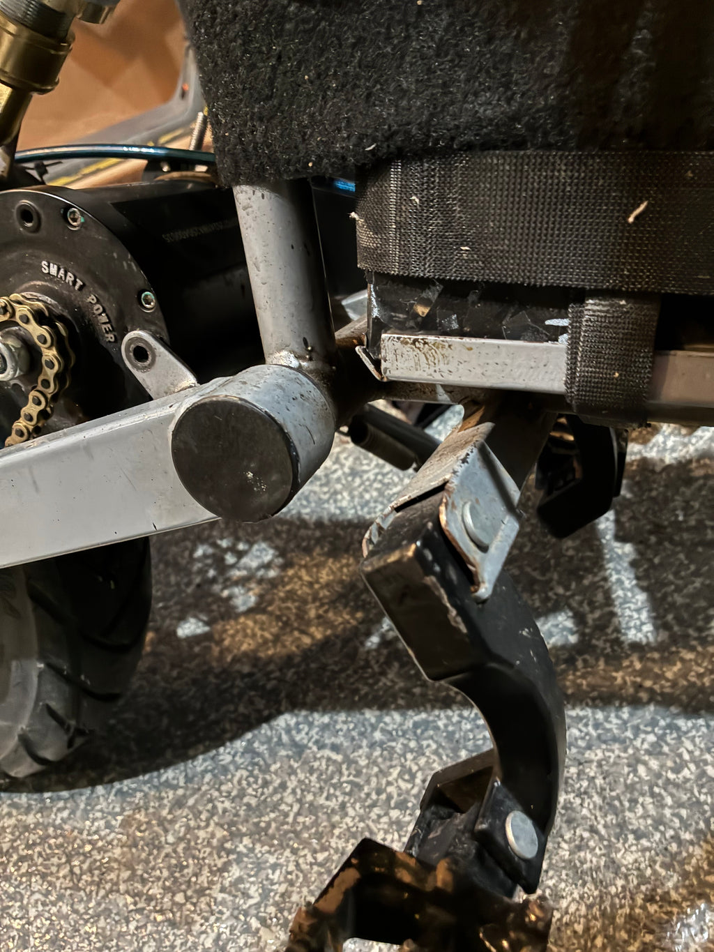 Swing arm end cap/airtag holder